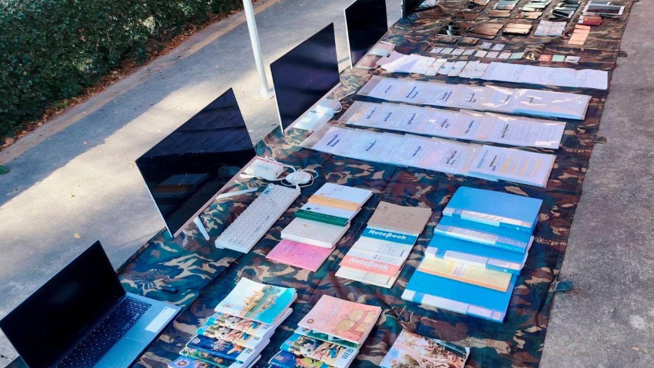 第二军区扩大打击查抄骗局巢穴,发现大量引导书和证据